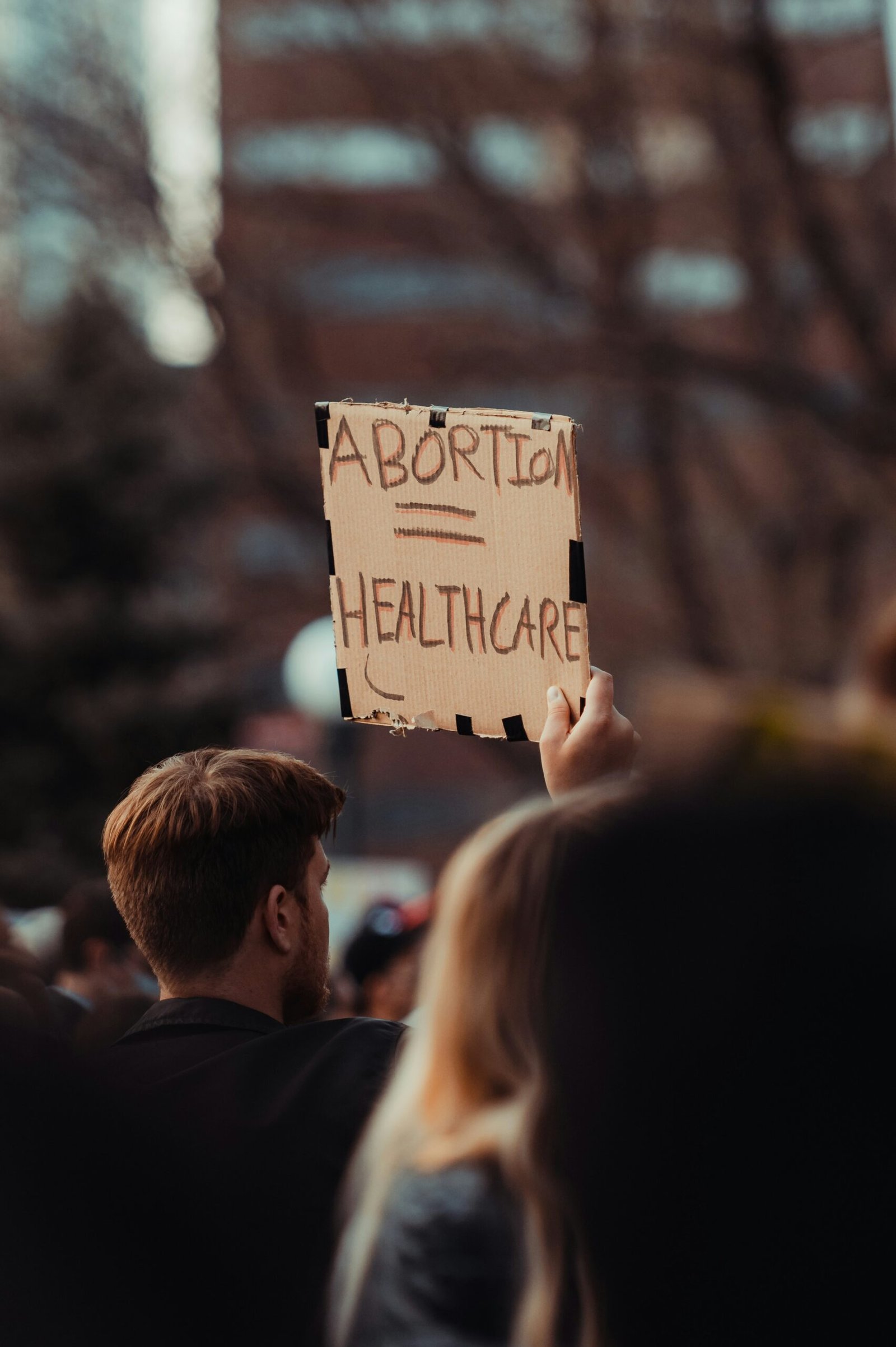 a man holding a sign